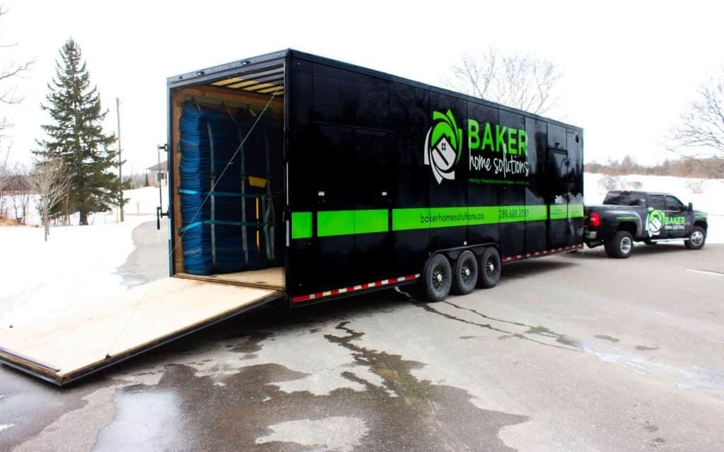 Mobile home renovation trailer with Baker Home Solutions branding, ready for home improvement projects.