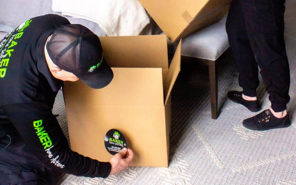 Moving company packing boxes for home or office relocation, professional moving services in Toronto.