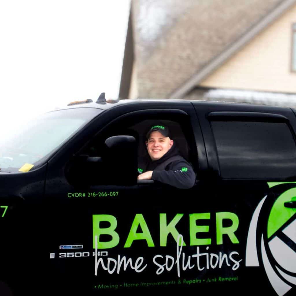 Professional home improvement contractor vehicle with Baker Home Solutions branding, showcasing reliable local service.