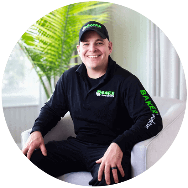 Professional handyman from Baker Home Solutions smiling in a comfortable indoor setting.
