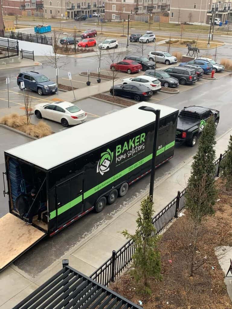 Parking lot with Baker Home Solutions truck.