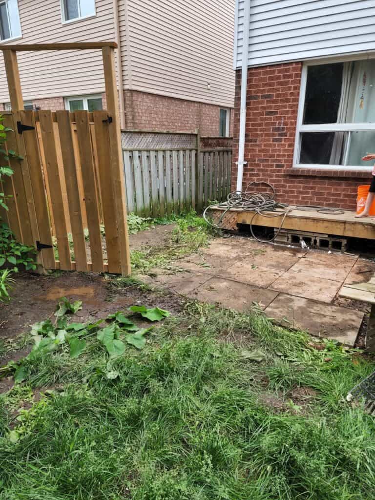 Backyard renovation with patio installation, fencing, and landscaping by Baker Home Solutions in Toronto.