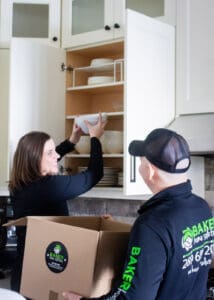 Skilled professionals installing kitchen cabinets.