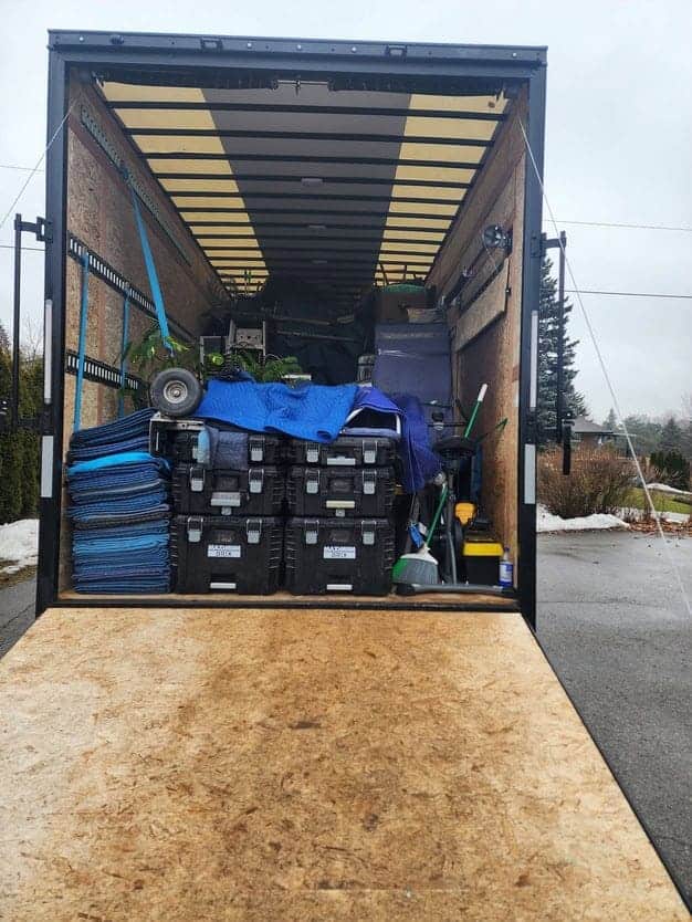 Professional moving truck loaded with tools and equipment for home renovation or construction projec.